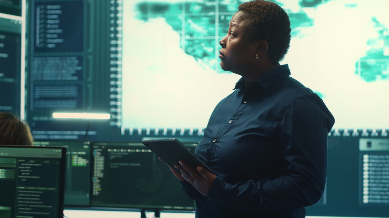Governmental hackers working on computer network in high tech office