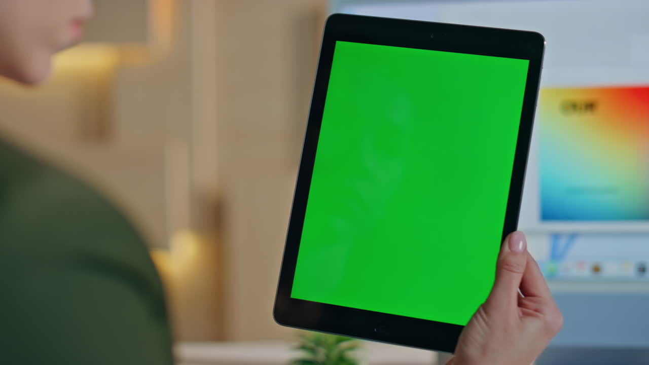 Entrepreneur looking project chroma key tablet on workplace studio close up.