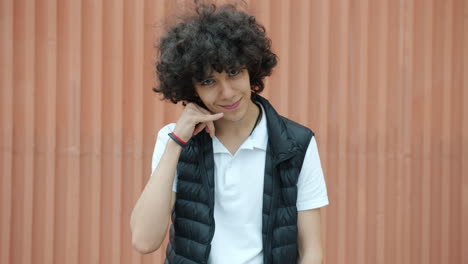 teenage boy posing outside
