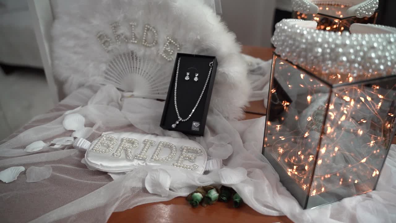 Stunning bridal accessories displayed at a wedding setup featuring elegant decor and attention to detail