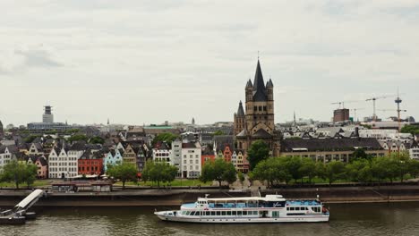 düsseldorf cityscape with river cruise and churches