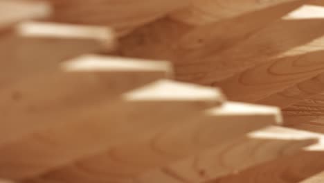 round wooden posts after wood processing. wooden sharpened logs on shelves