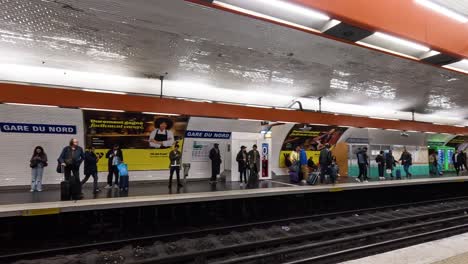 commuters waiting and moving in a subway station