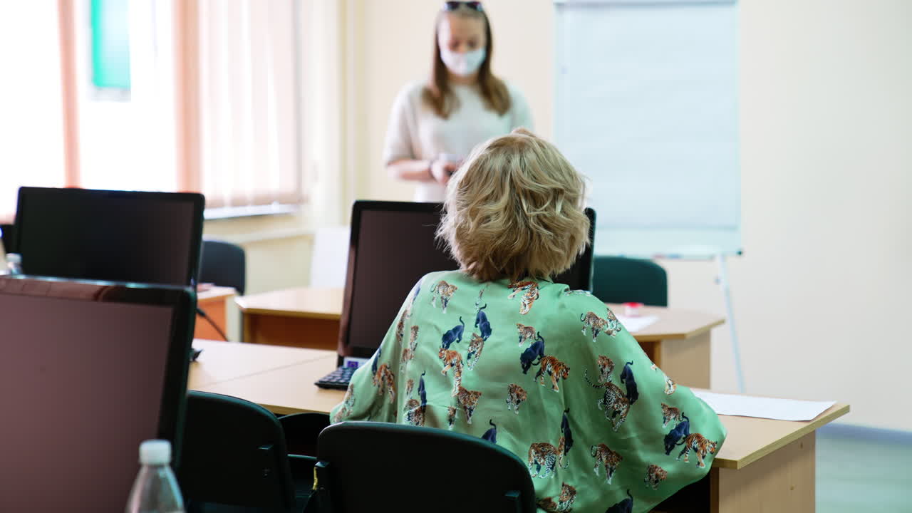 Female lecturer giving a lecture on ophthalmology and ophthalmic surgery. Students taking notes from a professor.
