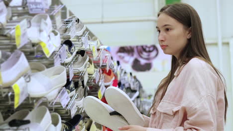 woman shopping for shoes in a store