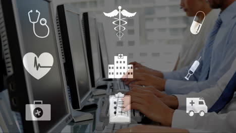 animación de iconos médicos sobre personas que escriben en teclados en la oficina