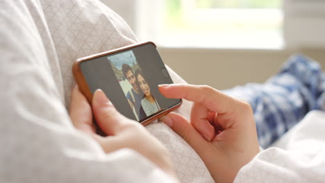 Closeup-of-a-couple-scrolling-through-images