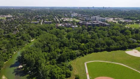 flying over a baseball diamond next to a river in london