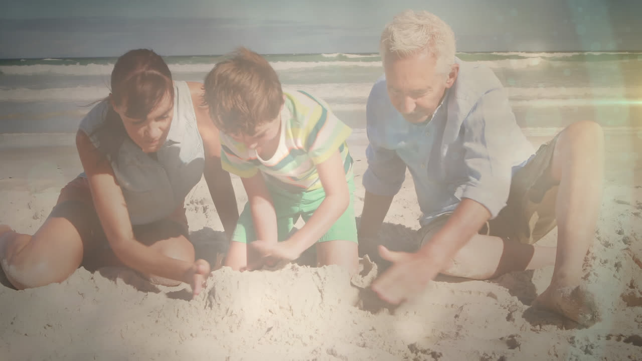 해변에서 딸과 손자와 함께 행복한 노인 위에 반이는 빛의 애니메이션