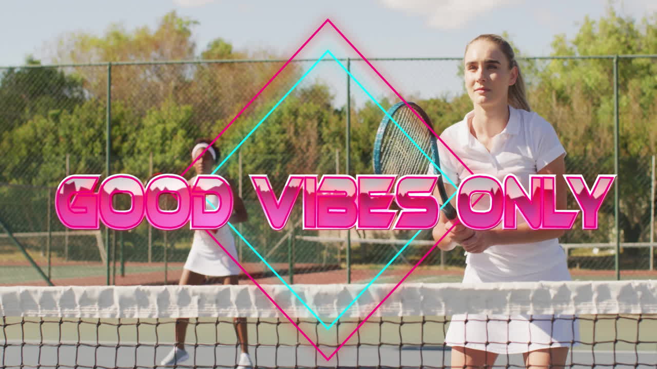 female tennis players swinging rackets over net on court, showing neon GOOD VIBES ONLY for fitness