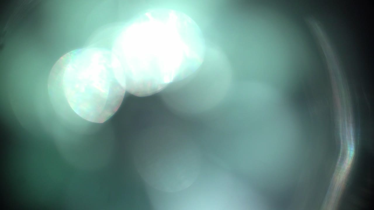 Sovrapposizione astratta di perdite di luce verde e effetto bokeh