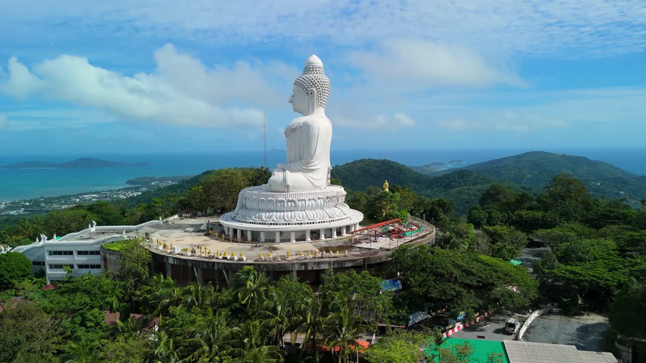 Aerial ascend orbit captures Phuket Big Buddha on Khao Nakkerd with wide Andaman vistas