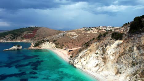 Aerial-of-Ksamil-beach-in-Albania,-crystal-clear-green-and-blue-sea