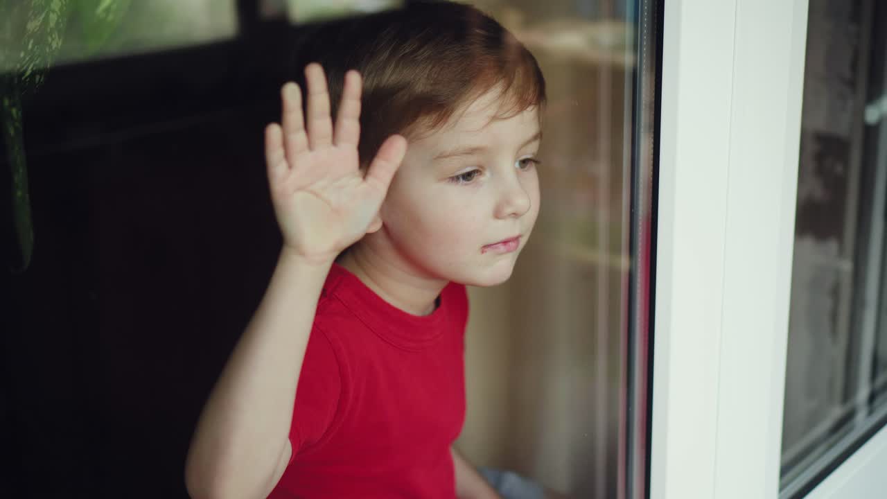 Portrait of little boy with medical face mask looking at camera