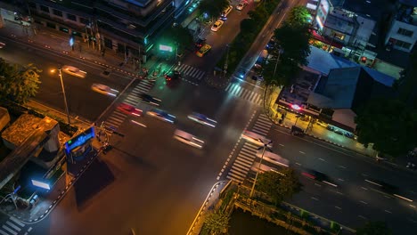 4k.time lapse traffic at intersection bangkok thailand