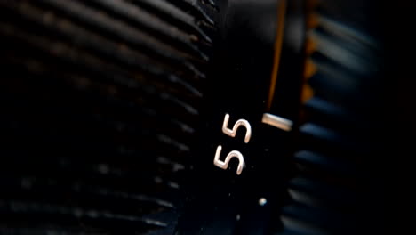 extreme close up of camera lens focus wheel turning.