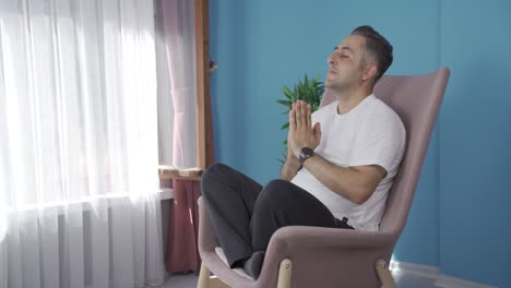 Man-in-meditation-in-front-of-the-window.