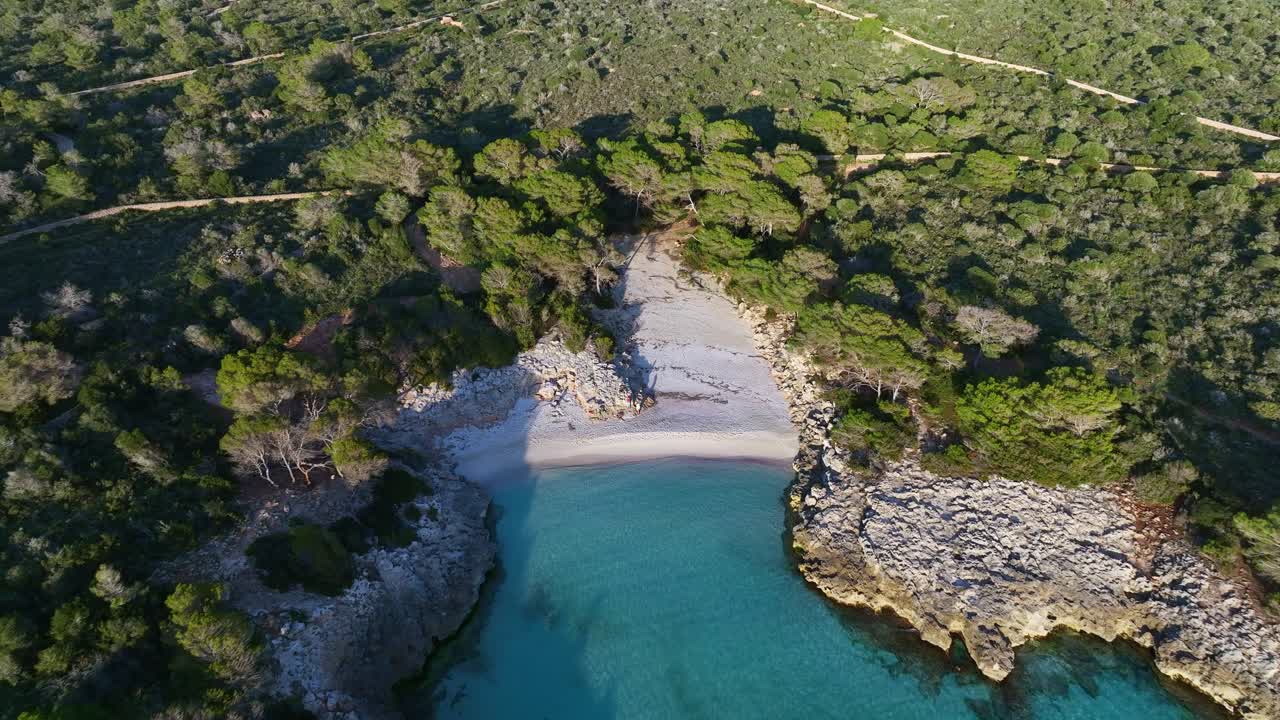 Aerial View Of Es Talaier Virgin Beach on a sunny day in Menorca Spain, Tracking Close Up