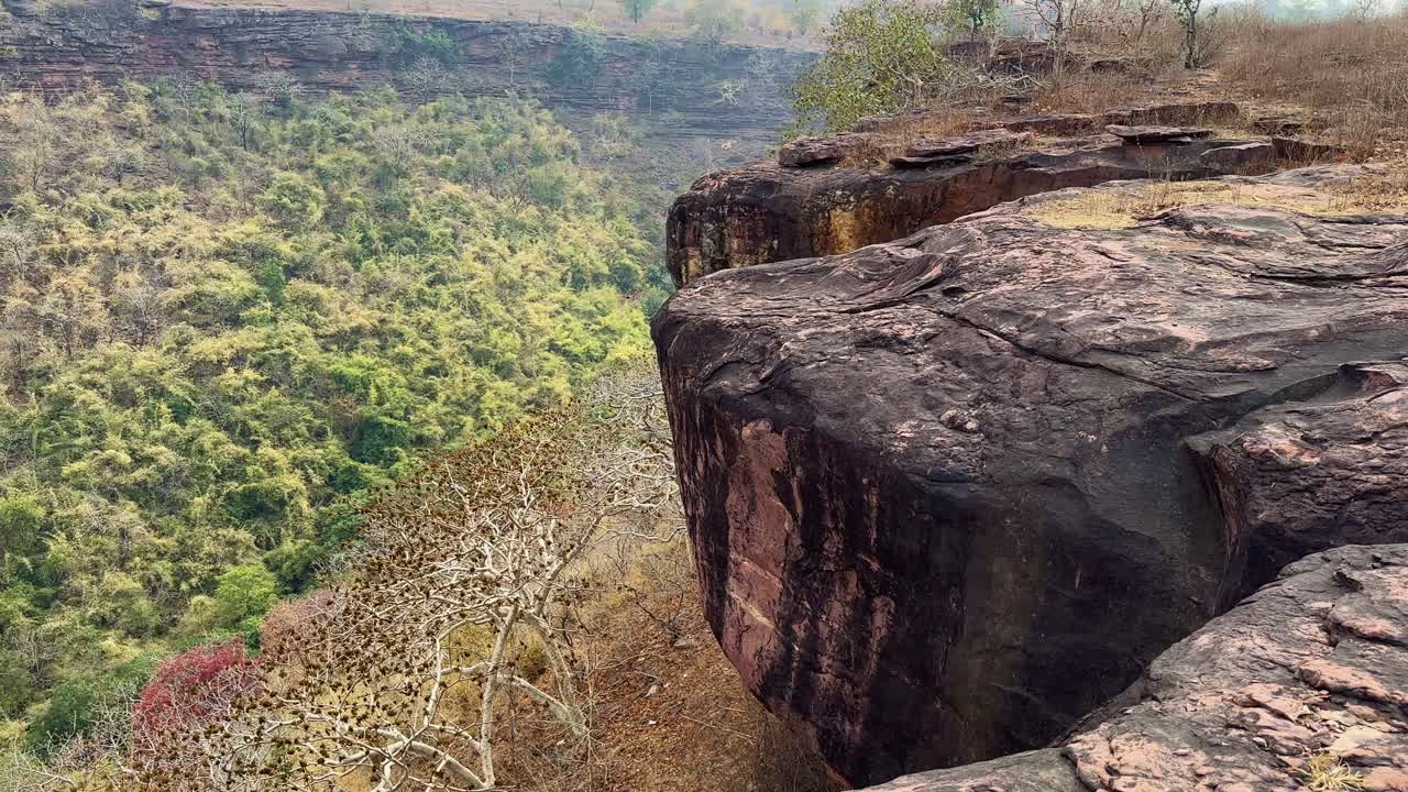jib up shot of a cliff near a rock mountain