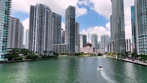 boat cruises amoung skyscrapers in miami florida