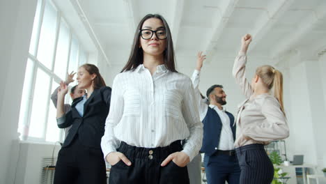 business team celebrating in office