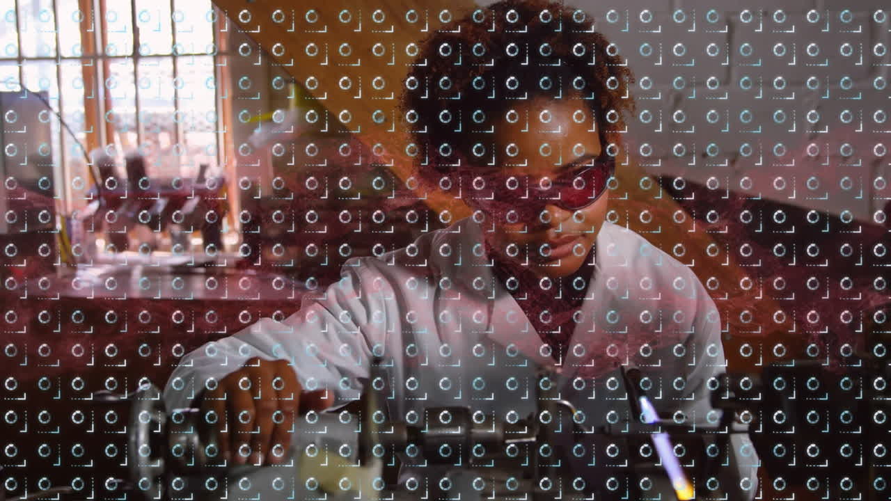 Animation of moving circles over african american female scientist working in lab