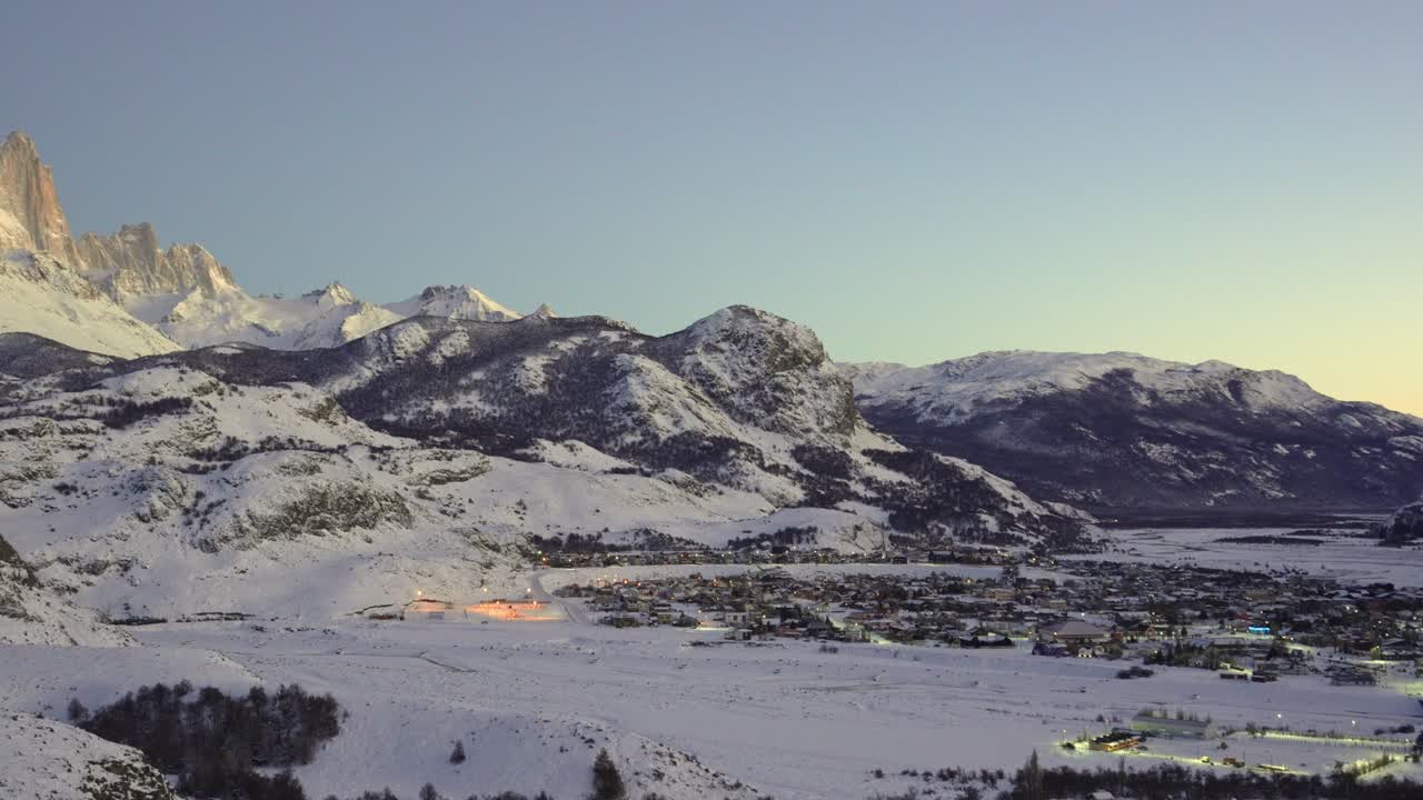 View of El Chalten town with mount Fitz Roy at dawn during winter