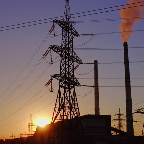 electricity pylons and lines at dusk