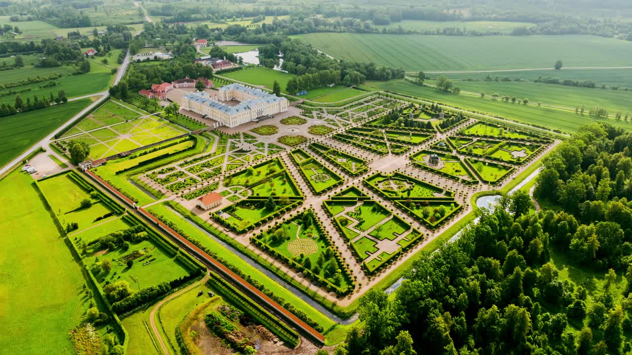 Front-facing timelapse reveals elegant symmetry of palace garden under clouds