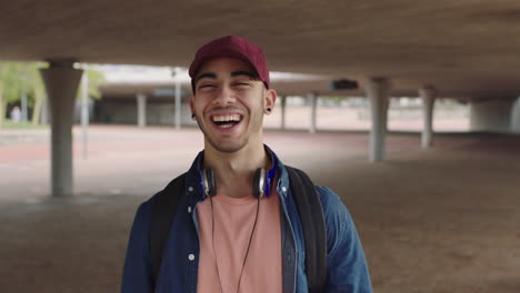 attractive young hispanic man student portrait of handsome man laughing happy proud