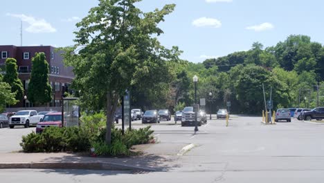 wide shot of car entering parking lot