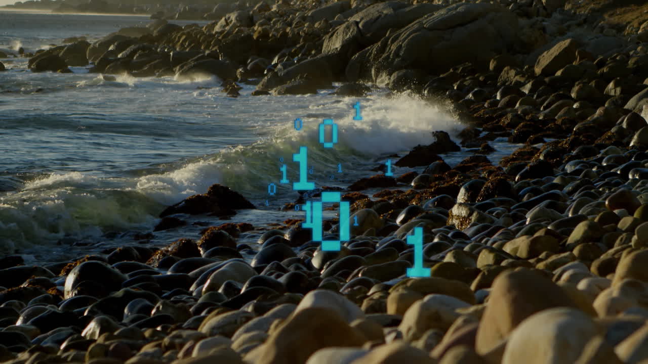 Waves crashing on rocky shore with digital binary code animation overlay