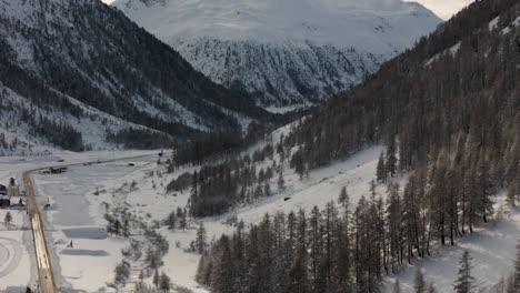 stunning livigno alps drone video: snow peaks, city and mountain town, ideal for high-quality winter and tourism ads