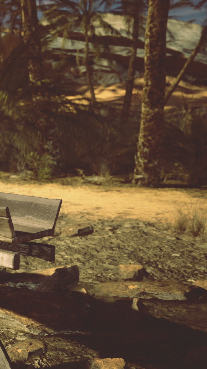 Empty bench near the fire pit in a desert setting during the evening hours
