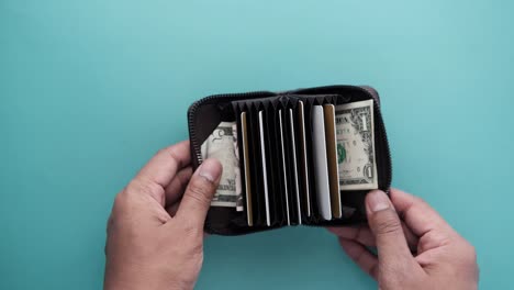 man hand taking credit card out from a wallet