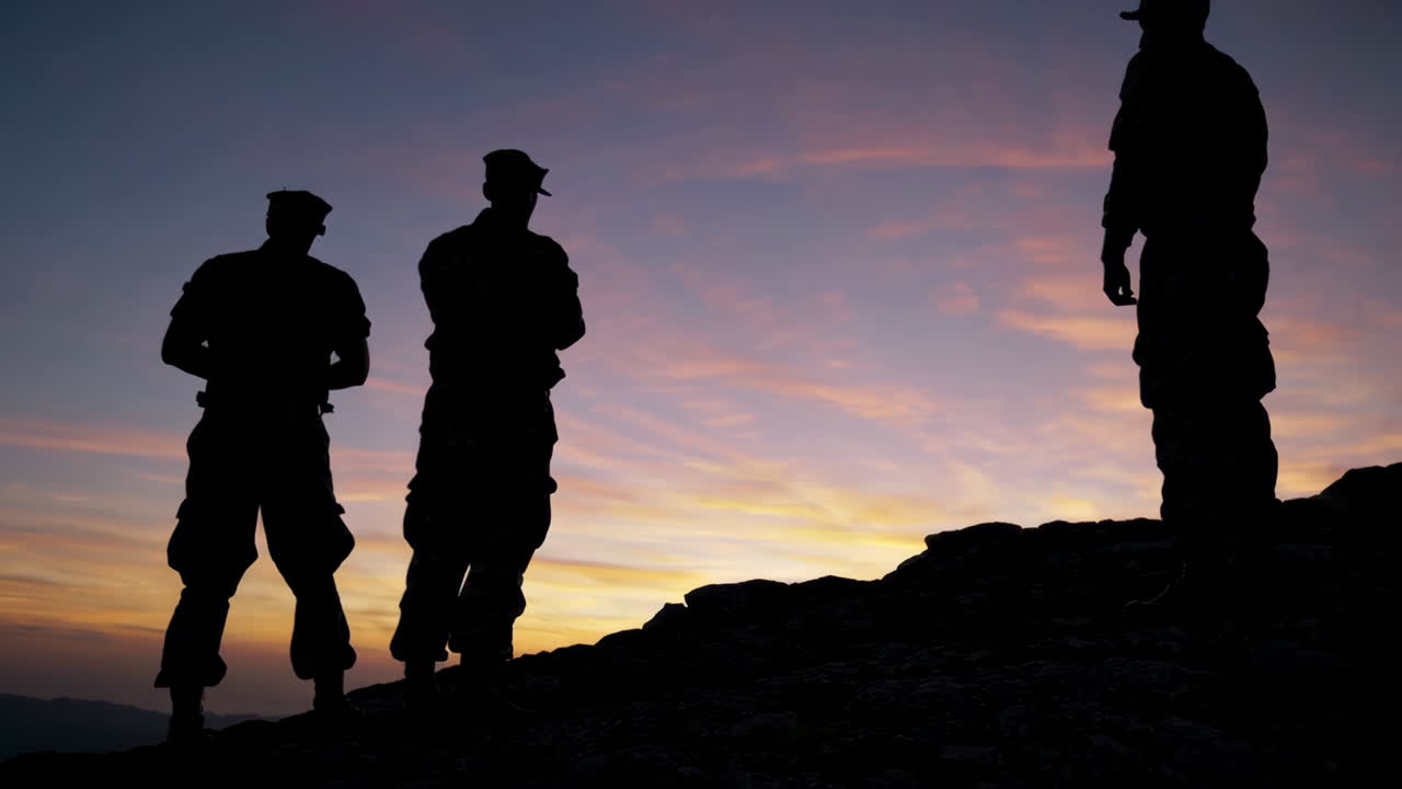 Soldiers on Mountaintop at Sunset