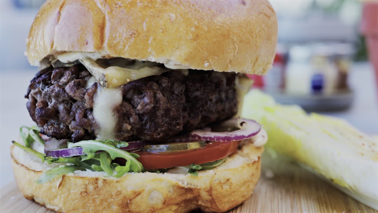 Close up of a hamburger on a plate at a restaurant