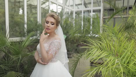 beautiful bride in a greenhouse