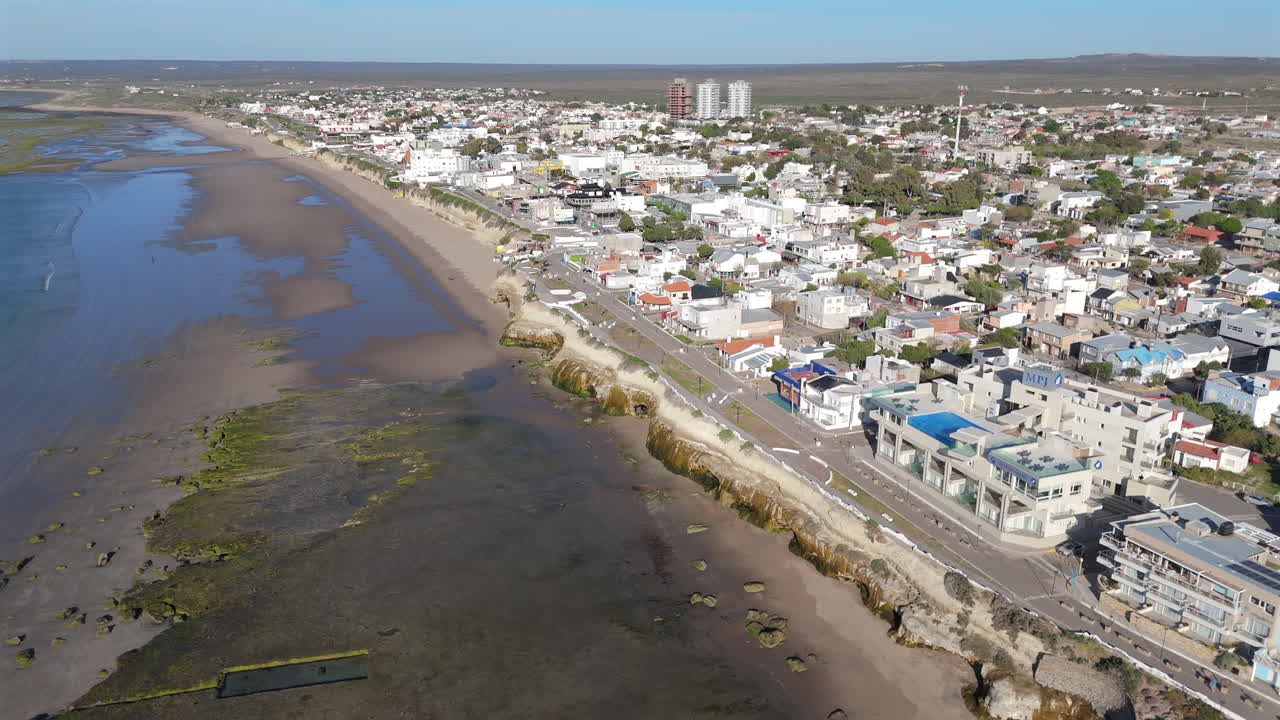 Aerial view drone city coastline of Argentina Las Grutas shore, no people