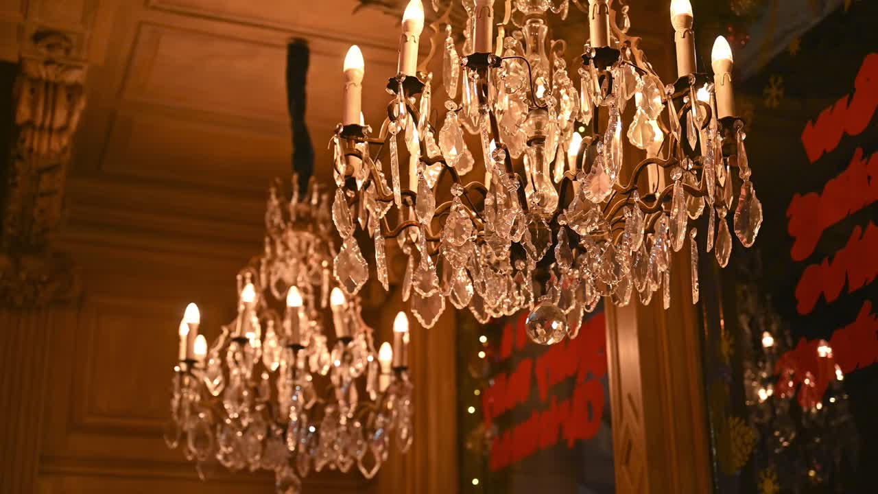 Set of chandeliers in a warm, cozy and inviting luxurious hotel lobby