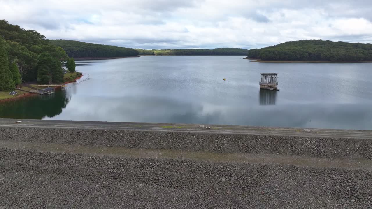 Scenic Reservoir Landscape with Tower