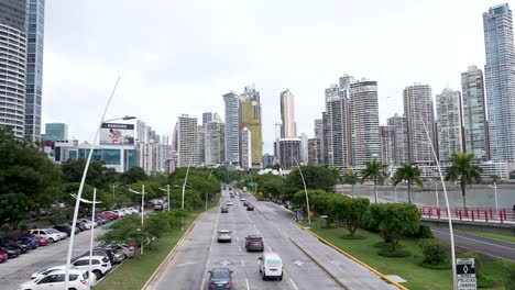 avenida balboa road in panama city, panama, lined with palm trees and a skyline of tall buildings