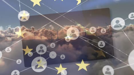 animación de las estrellas de la unión europea sobre conexiones, nubes y turbinas eólicas al atardecer