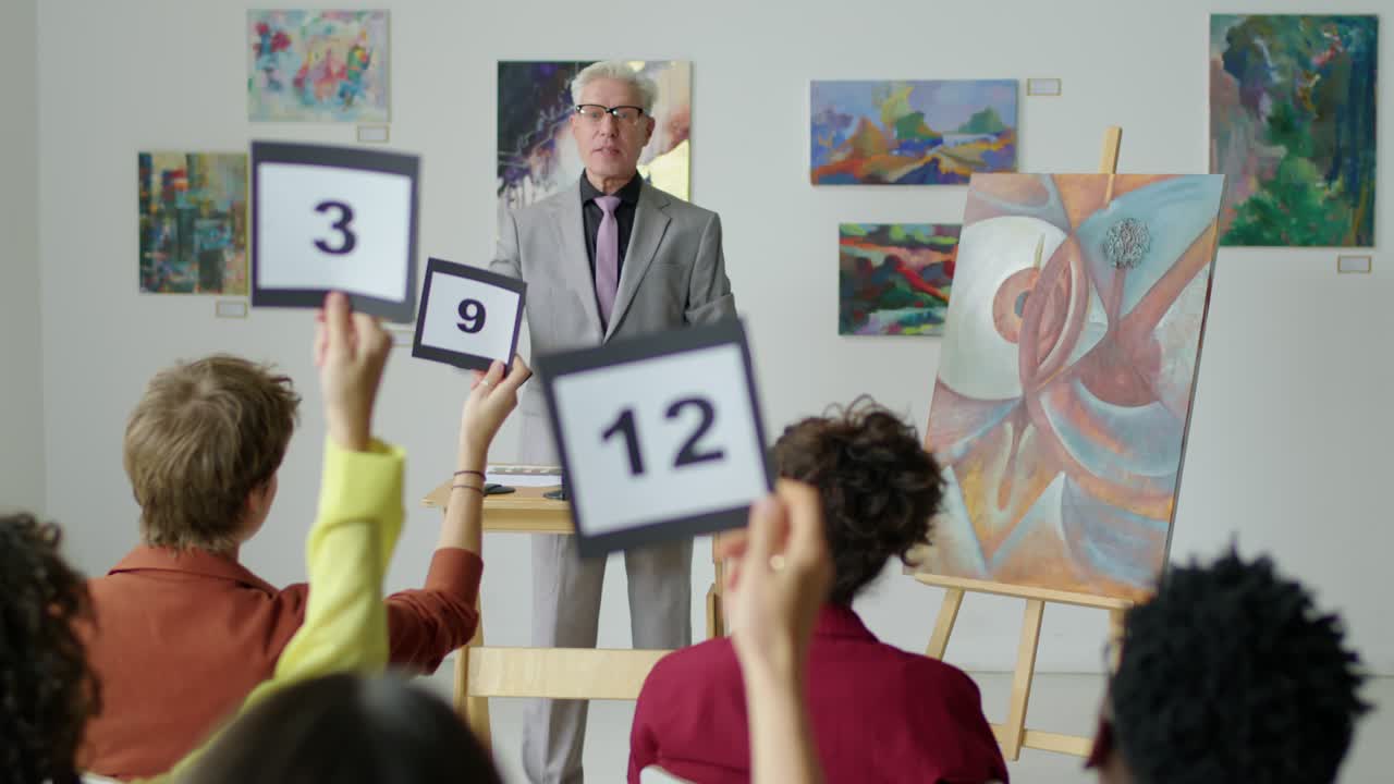 Auctioneer Selling Contemporary Painting on Art Auction