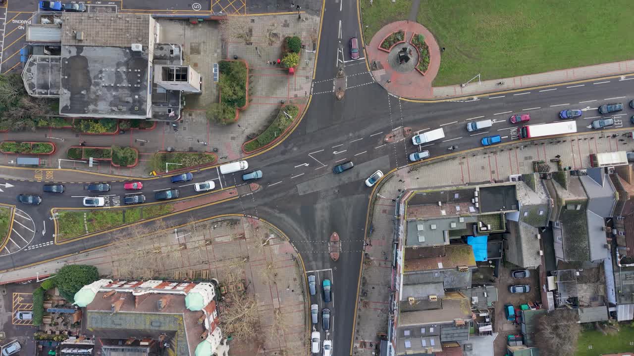 Drone top-down crossroad at Wanstead Underground station with traffic flow