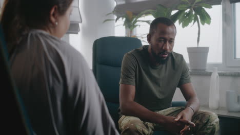 man and woman talking in a room