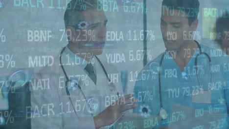 animation of stock market and data processing over caucasian male doctors talking