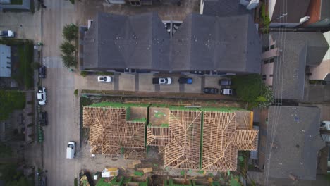 overhead drone view of framed houses being built