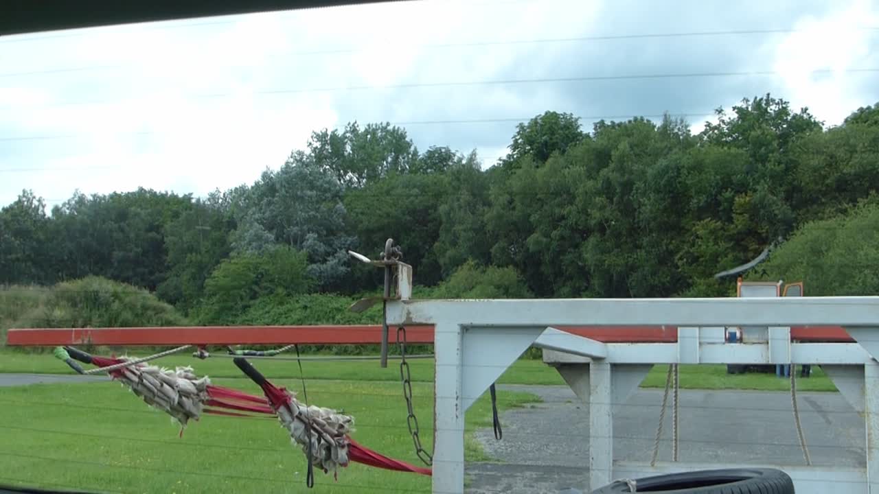 ropes for launching a glider pilot are pulled to the launch point in preparation