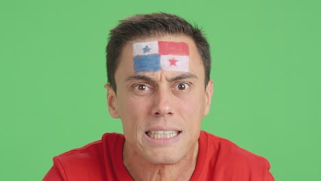 man with panamanian national flag upset with a referee